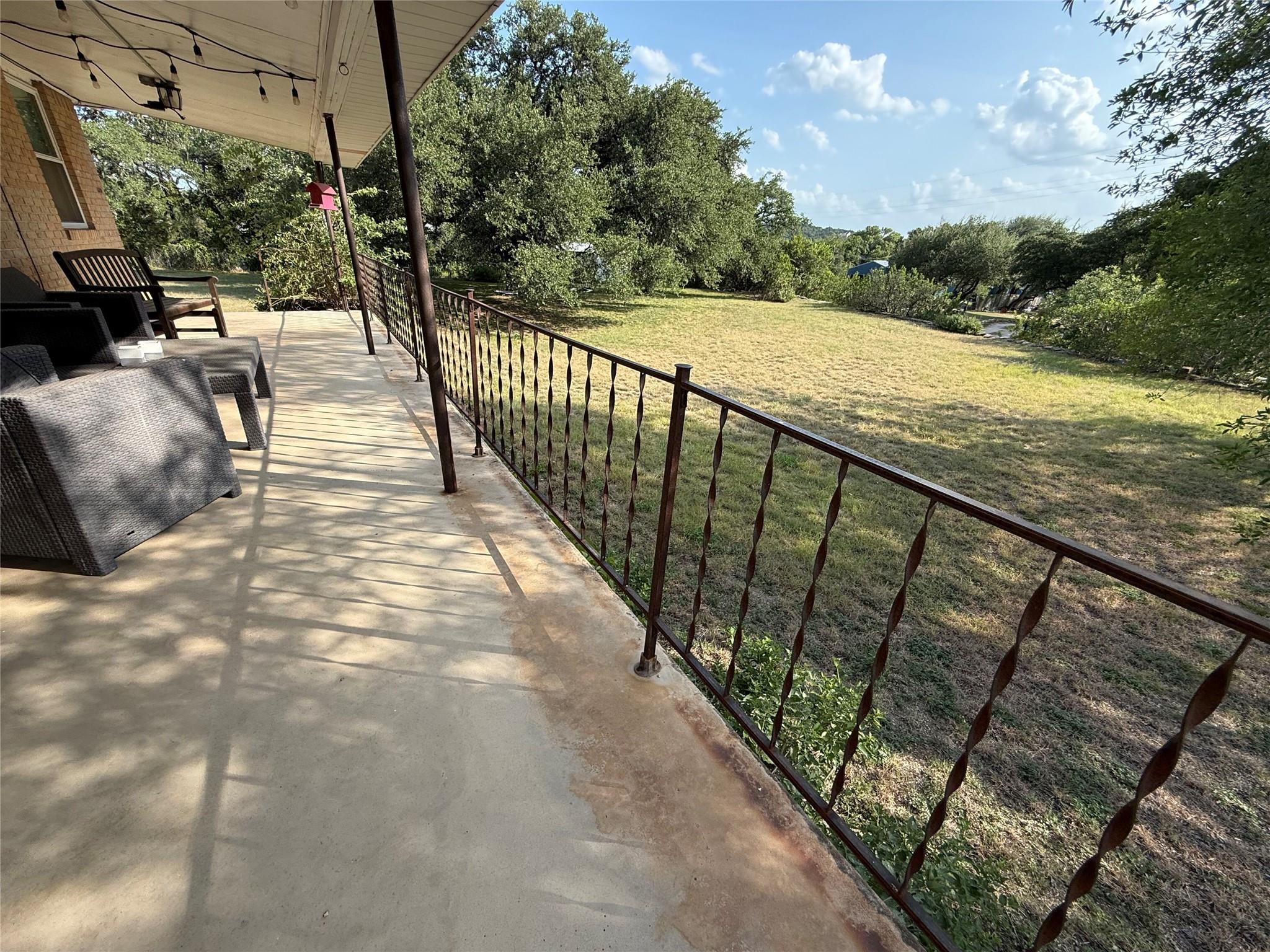 Covered porch overlooking Triple Oaks Estate